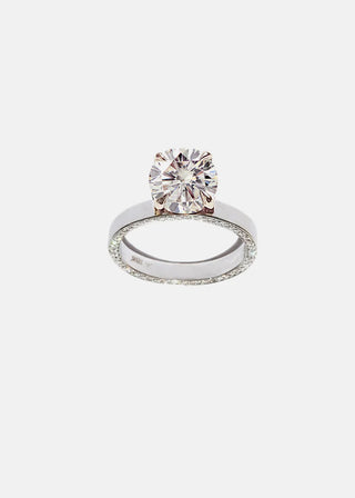 Luminous 2.0ct round pave moissanite wedding band shown on a finger