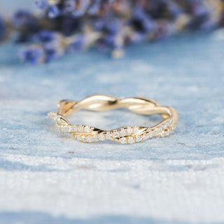 Refined round full eternity moissanite wedding band angled view showing its sparkle image 2