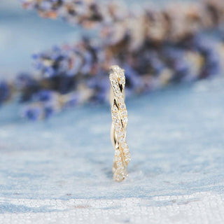 Refined round full eternity moissanite wedding band close up of the setting image 2