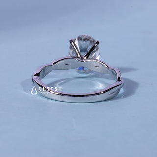 Front standing view of the Oval Cut Pave Infinity Moissanite Engagement Ring showing the prong setting