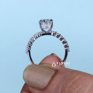 Brilliant 2.0ct oval hidden halo moissanite ring shown on a finger