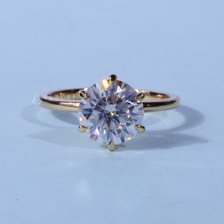 Round Cut Solitaire Moissanite Engagement Ring front view with upright centre stone
