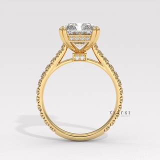 Side profile of a radiant cut moissanite engagement ring with a pave band under bright light
