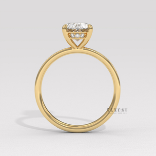 Detailed setting shot of a oval cut moissanite engagement ring with a hidden halo and pave band