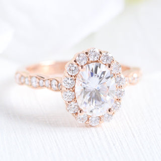 Sparkling 1.50ct oval halo moissanite ring shown on a finger
