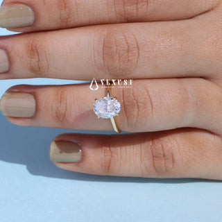 Gorgeous 1.0ct oval hidden halo moissanite ring tilted view catching the light