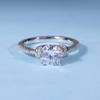 Round Cathedral Moissanite Engagement Ring with Halo Pave front view