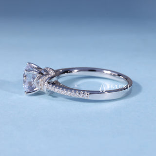 Angled view of Round Cathedral Moissanite Engagement Ring with Halo Pave