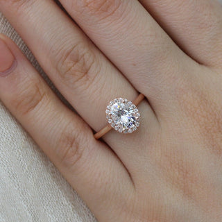 Vintage 1.50ct oval halo moissanite ring tilted view catching the light
