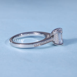 Angled view of Emerald Cut Hidden Halo Engagement Ring with Moissanite Pave