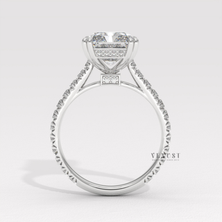 Side profile of a radiant cut moissanite engagement ring with a pave band up close