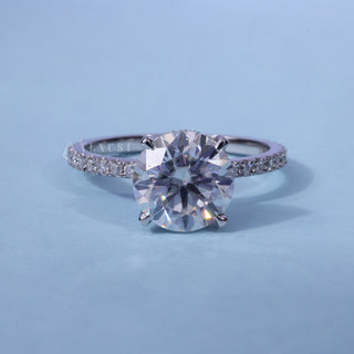 Hidden Halo Round Cut Moissanite Engagement Ring front view with upright centre stone