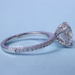 Hidden Halo Round Cut Moissanite Engagement Ring resting on its side showing the slim band
