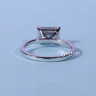 Angled view of the Solitaire Moissanite East West Emerald Cut Ring band and setting