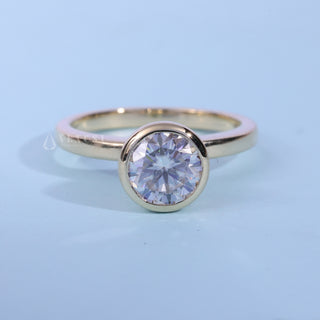 Bezel Halo Solitaire Round Cut Moissanite Ring front view with upright centre stone
