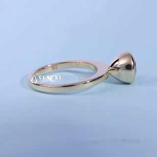 Bezel Halo Solitaire Round Cut Moissanite Ring resting on its side showing the slim band