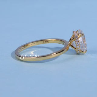 Hidden Halo Oval Cut Moissanite Engagement Ring resting on its side showing the slim band