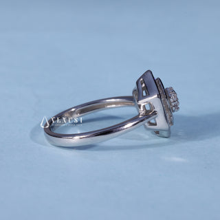 Angled view of 0.70CT Round Bezel Moissanite Cluster Engagement Ring
