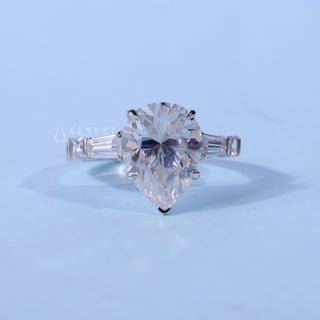 Pear Cut Three Stone Moissanite Ring front view with upright centre stone