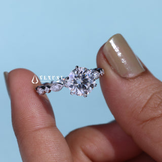 Modern 1.0ct round cluster moissanite ring angled view showing its sparkle