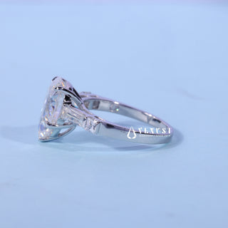 Angled view of the Pear Cut Three Stone Moissanite Ring band and setting