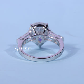 Front standing view of the Pear Cut Three Stone Moissanite Ring showing the prong setting