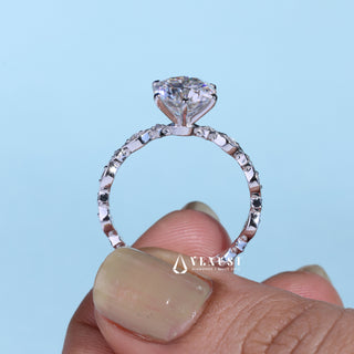 Modern 1.0ct round cluster moissanite ring shown on a finger