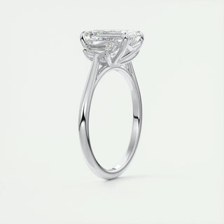 Classic 1.91ct emerald three stone moissanite ring shown on a finger