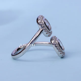 Bezel Set Halo Asscher Cut Moissanite Ring resting on its side showing the slim band