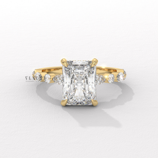 Front view of a round cut moissanite engagement ring with a hidden halo and pave band in fine detail