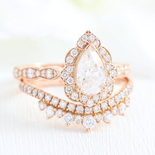 Delicate 1.0ct pear halo moissanite ring angled view showing its sparkle