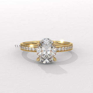 Close-up of a oval cut moissanite engagement ring with a hidden halo and pave band