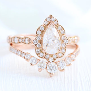 Refined 1.0ct pear halo moissanite ring angled view showing its sparkle