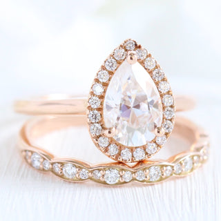 Lustrous 1.50ct pear halo moissanite ring angled view showing its sparkle