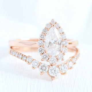 Elegant 1.0ct pear halo moissanite ring angled view showing its sparkle
