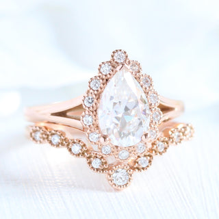Timeless 1.50ct pear halo moissanite ring angled view showing its sparkle