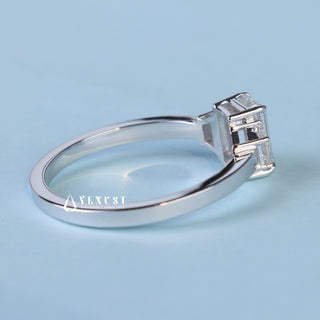 Elegant 1.0ct emerald three stone moissanite ring shown on a finger