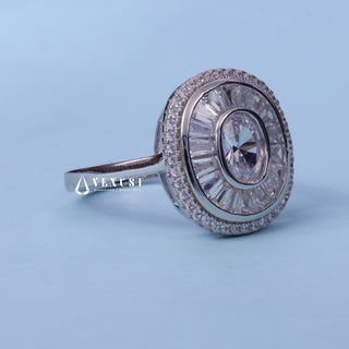 Oval Cut Halo Bezel Set Moissanite Engagement Ring resting on its side showing the slim band