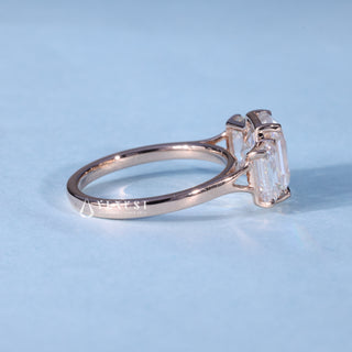 Angled view of Emerald Cut 3 Stone Moissanite Engagement Ring with Pave