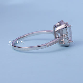 Halo Pave Moissanite Emerald Cut Ring resting on its side showing the slim band