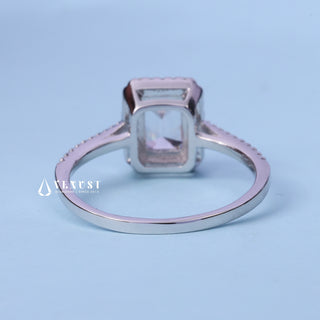 Front standing view of the Halo Pave Moissanite Emerald Cut Ring showing the prong setting