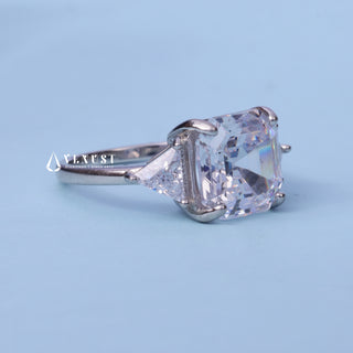 Front standing view of the Three Stone Moissanite Asscher Cut Engagement Ring showing the prong setting
