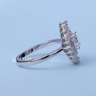 Halo Cluster Round Brilliant Moissanite Engagement Ring resting on its side showing the slim band