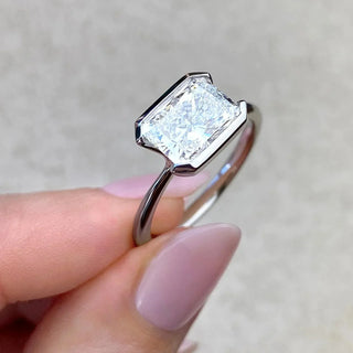 Sparkling 1.91ct emerald solitaire moissanite ring overhead view