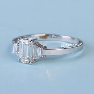 Elegant 1.0ct emerald three stone moissanite ring angled view showing its sparkle