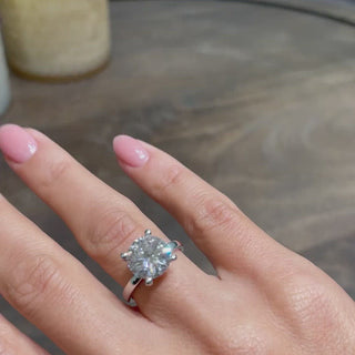 Bold 3.0ct round solitaire moissanite ring shown on a finger