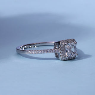 Sparkling Halo Pave Asscher Cut Moissanite Ring resting on its side showing the slim band