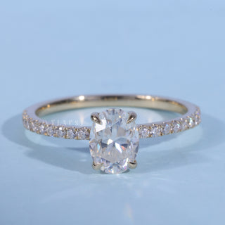 Pave Oval Cut Moissanite Engagement Ring front view with upright centre stone