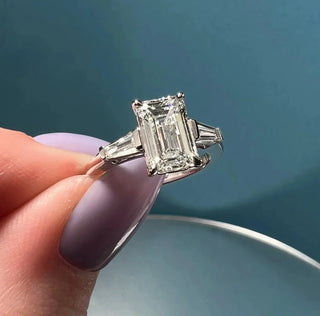 Stunning 1.91ct emerald three stone moissanite ring angled view showing its sparkle
