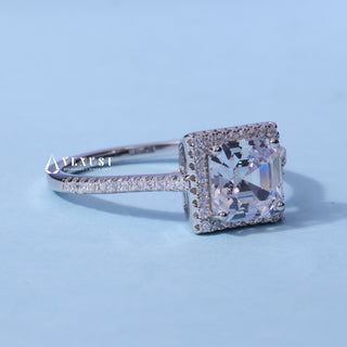 Halo Pave Moissanite Asscher Cut Ring resting on its side showing the slim band